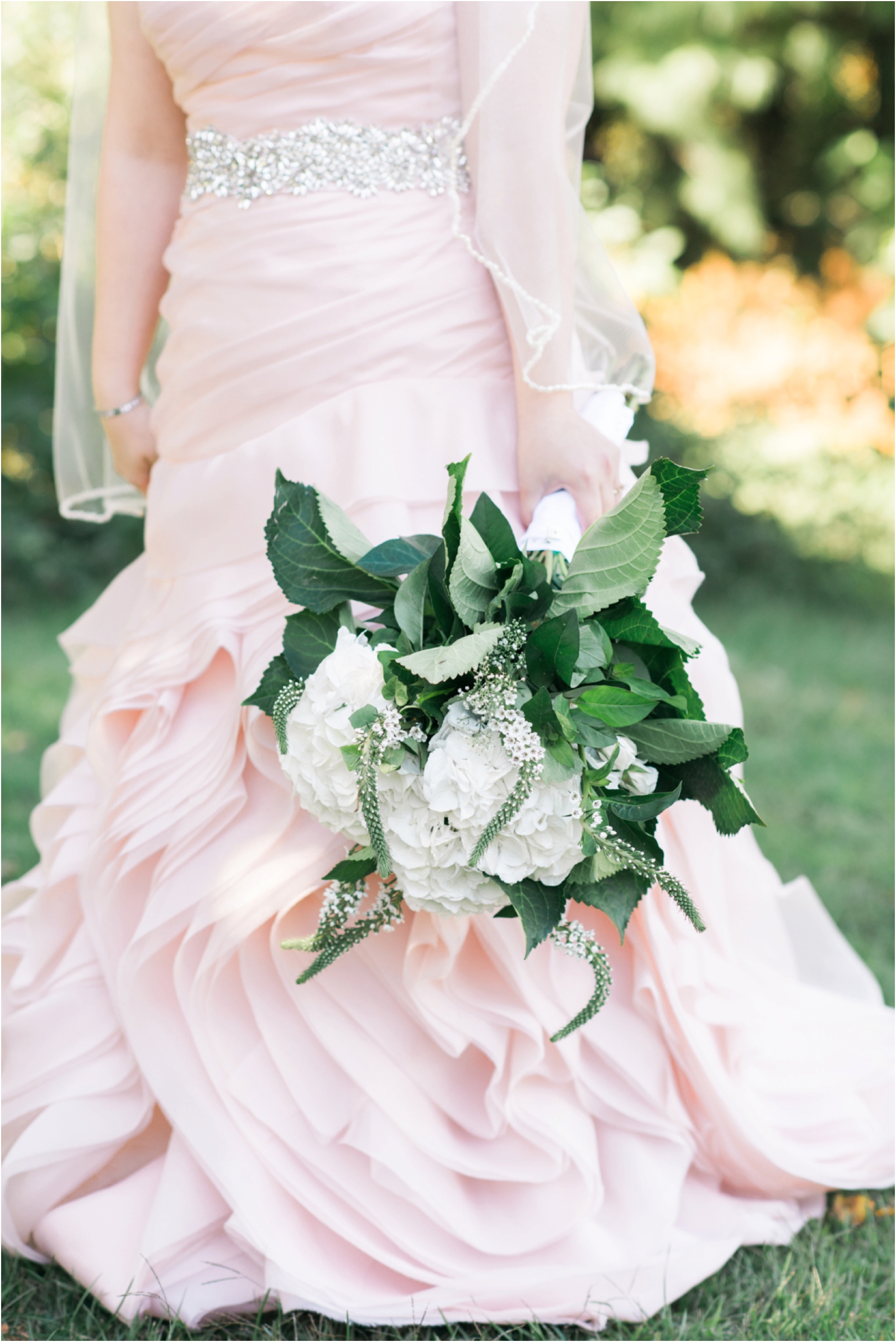 oversized bridal bouquet and blush gown