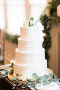 4 tier buttercream wedding cake photographed by Joy Michelle Photography