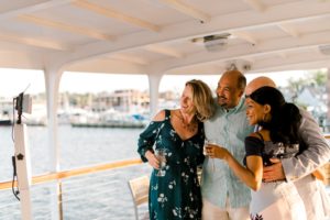 Navy and blush pink wedding celebration details during a sunset cruise on the Chesapeake Bay in Annapolis, Maryland.