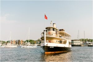 Navy and blush pink wedding celebration details during a sunset cruise on the Chesapeake Bay in Annapolis, Maryland.